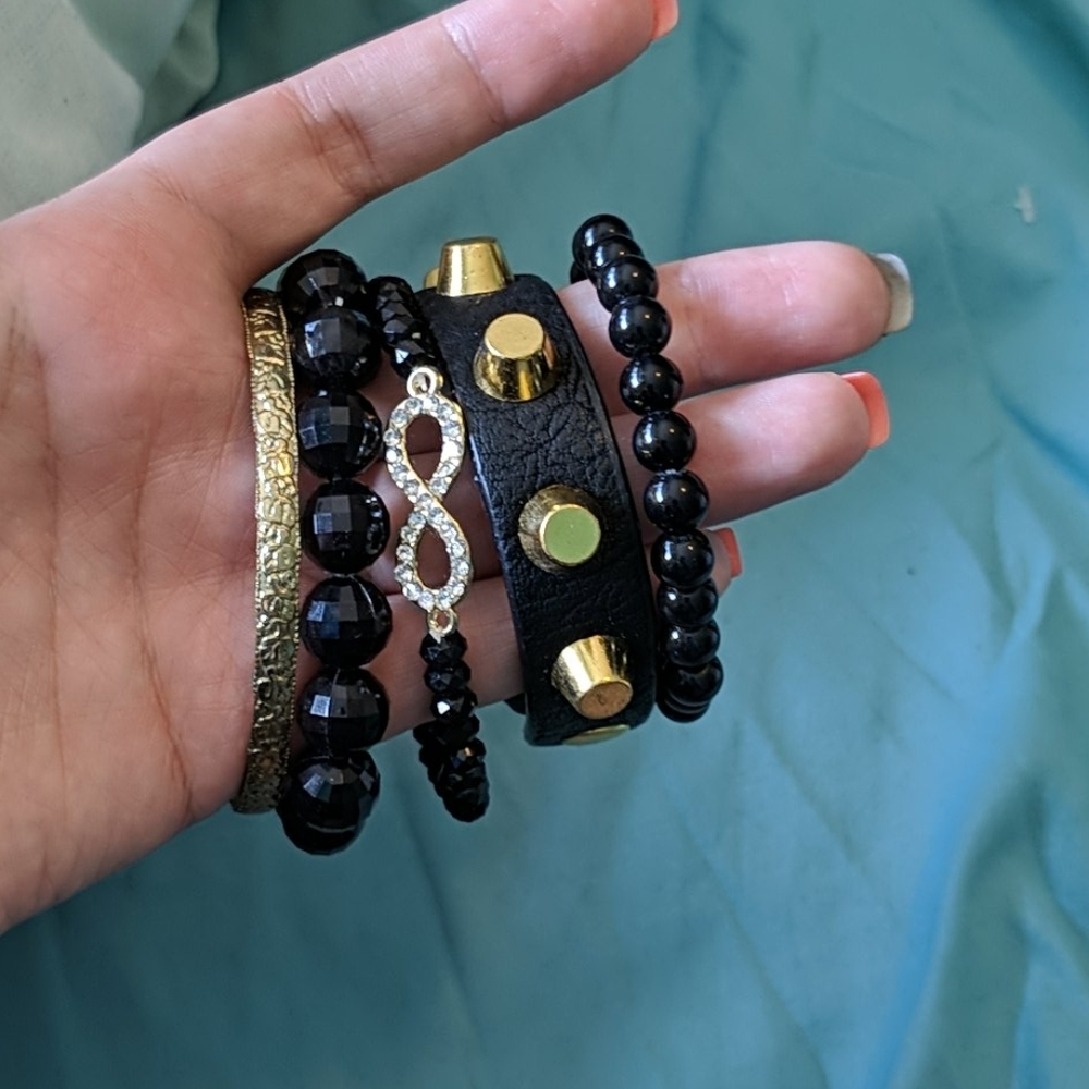 Black and gold stackable bracelets w/watch